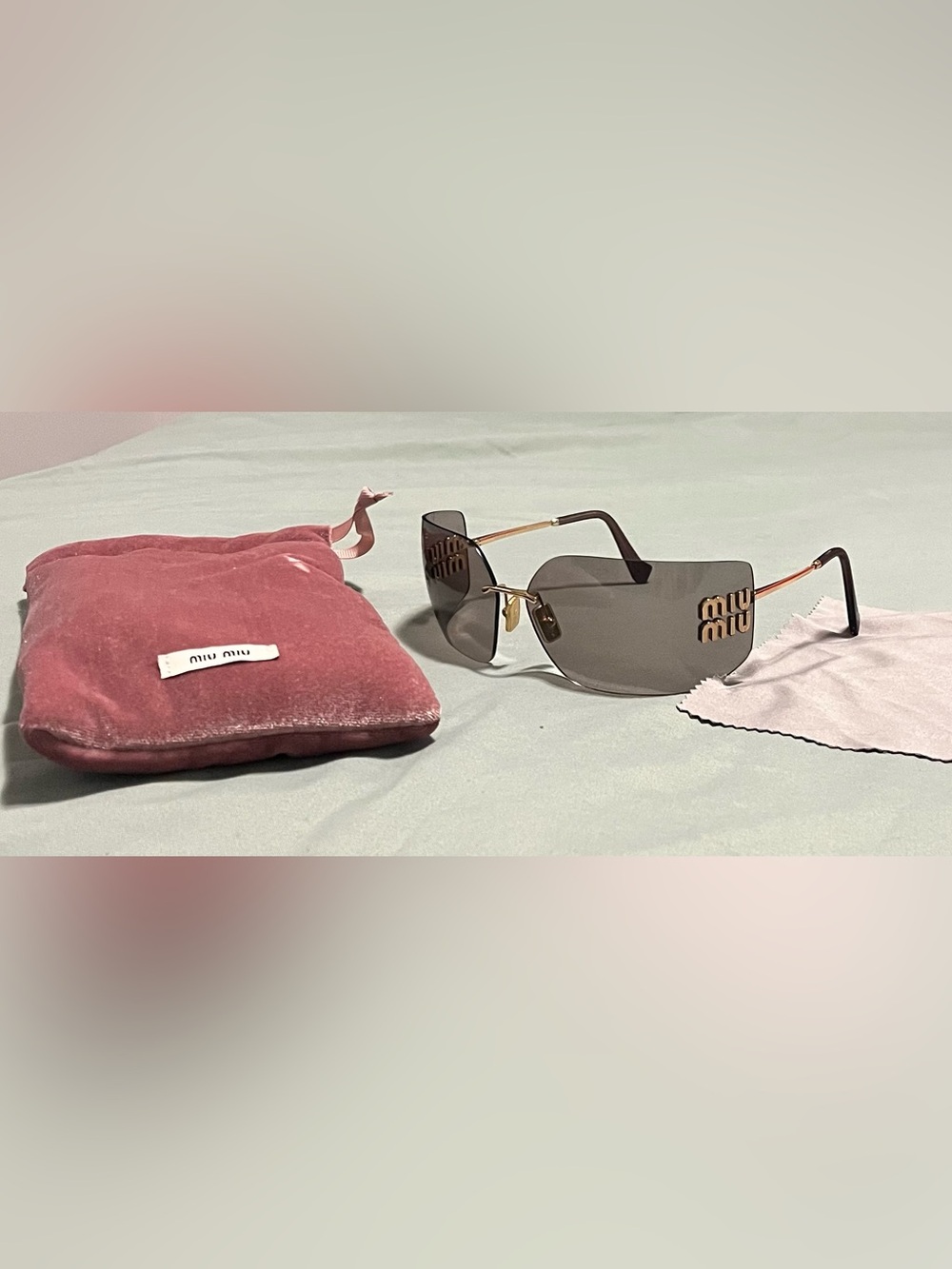 Miu Miu Rimless Sunglasses with Gray Lenses and Gold Logo
